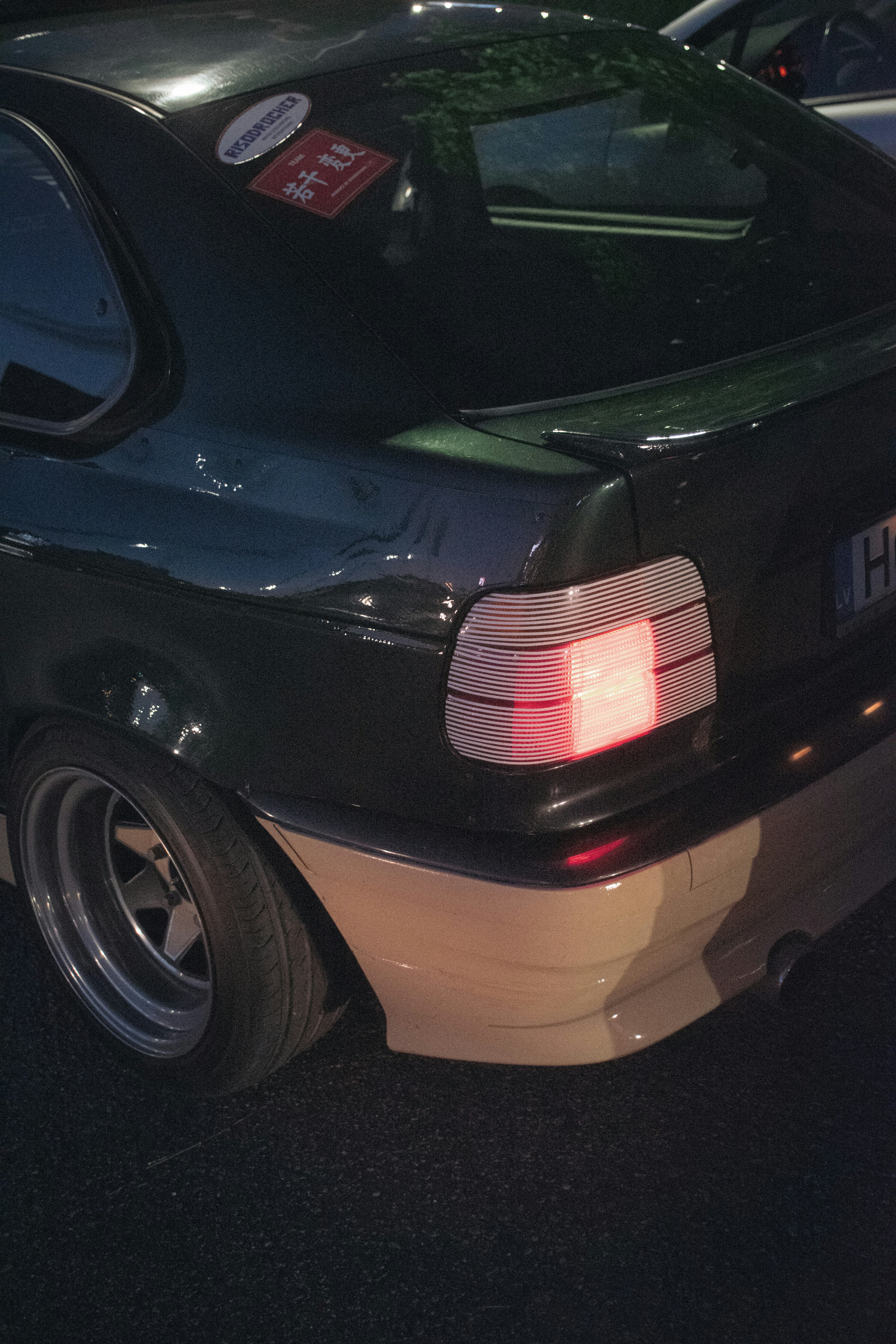 black car with white and red license plate