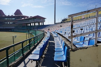 blue and white lounge chairs on green grass field during daytime