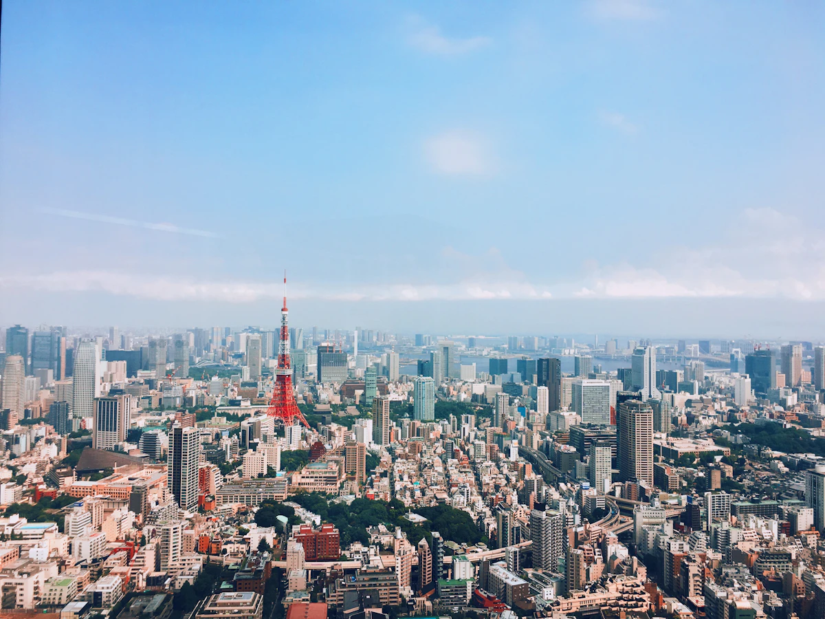 Aerial view of Tokyo showing the mix of high-rise buildings and residential areas across different wards