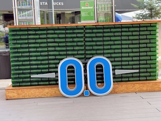 blue and white signage on brown brick wall