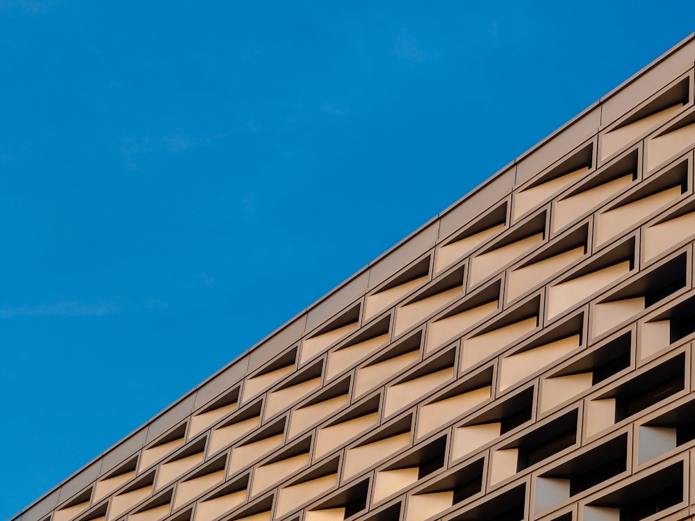 brown concrete building under blue sky during daytime