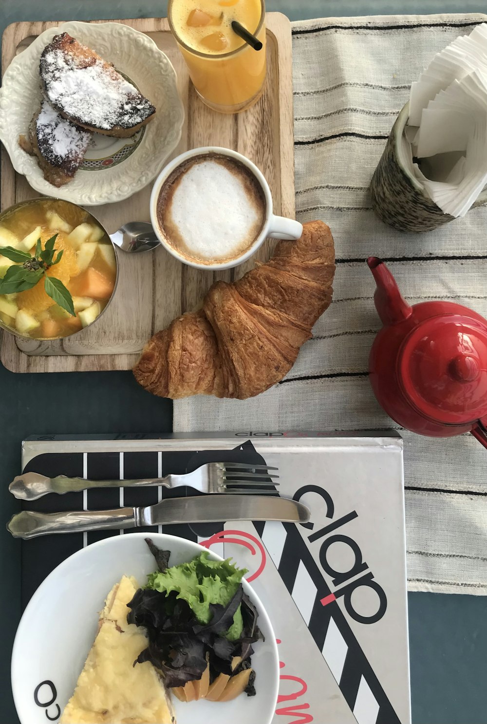 sliced bread and sliced fruit on white ceramic plate