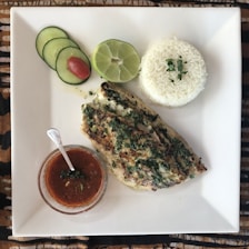 sliced of pizza on white ceramic plate