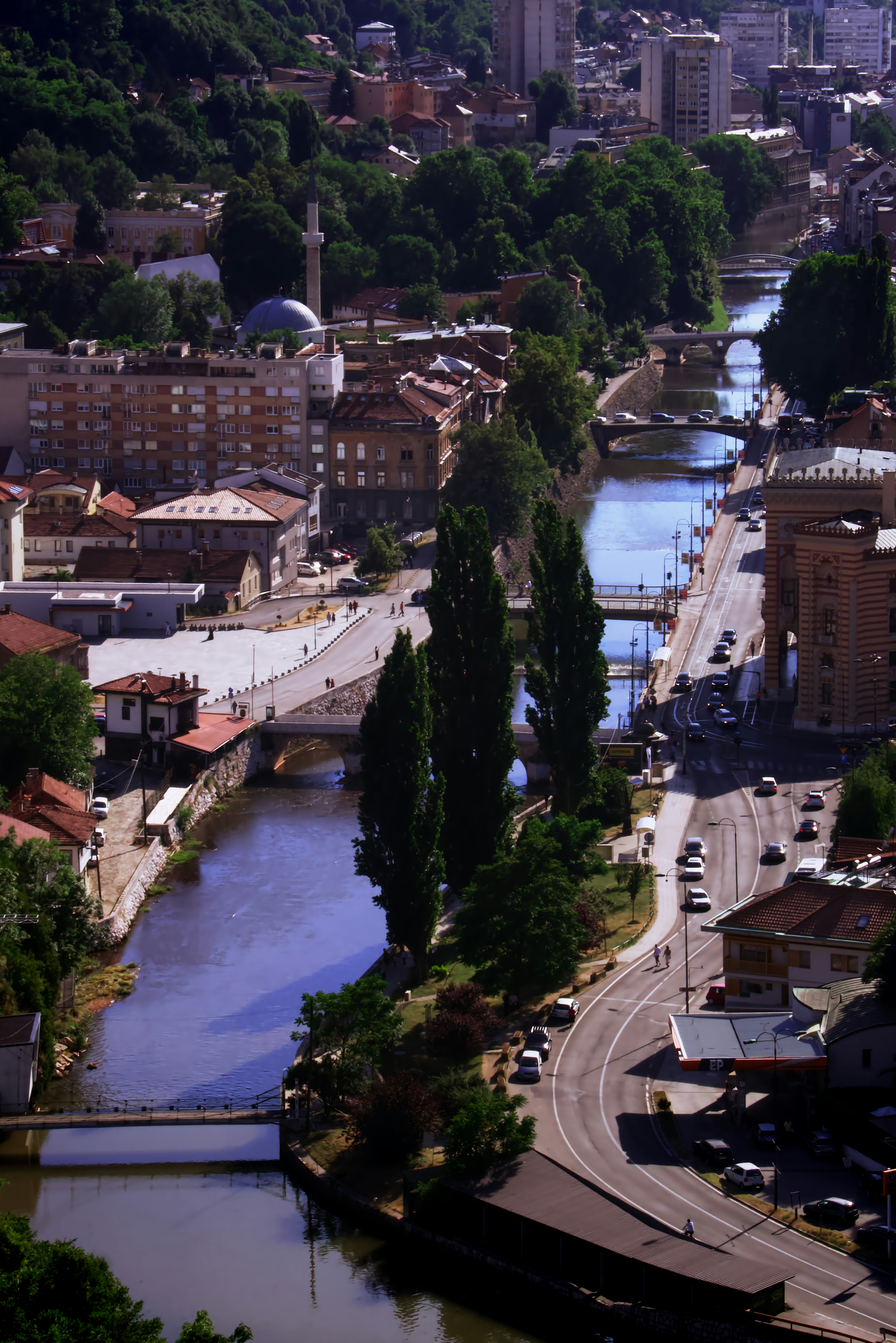 a river running through a city surrounded by tall buildings