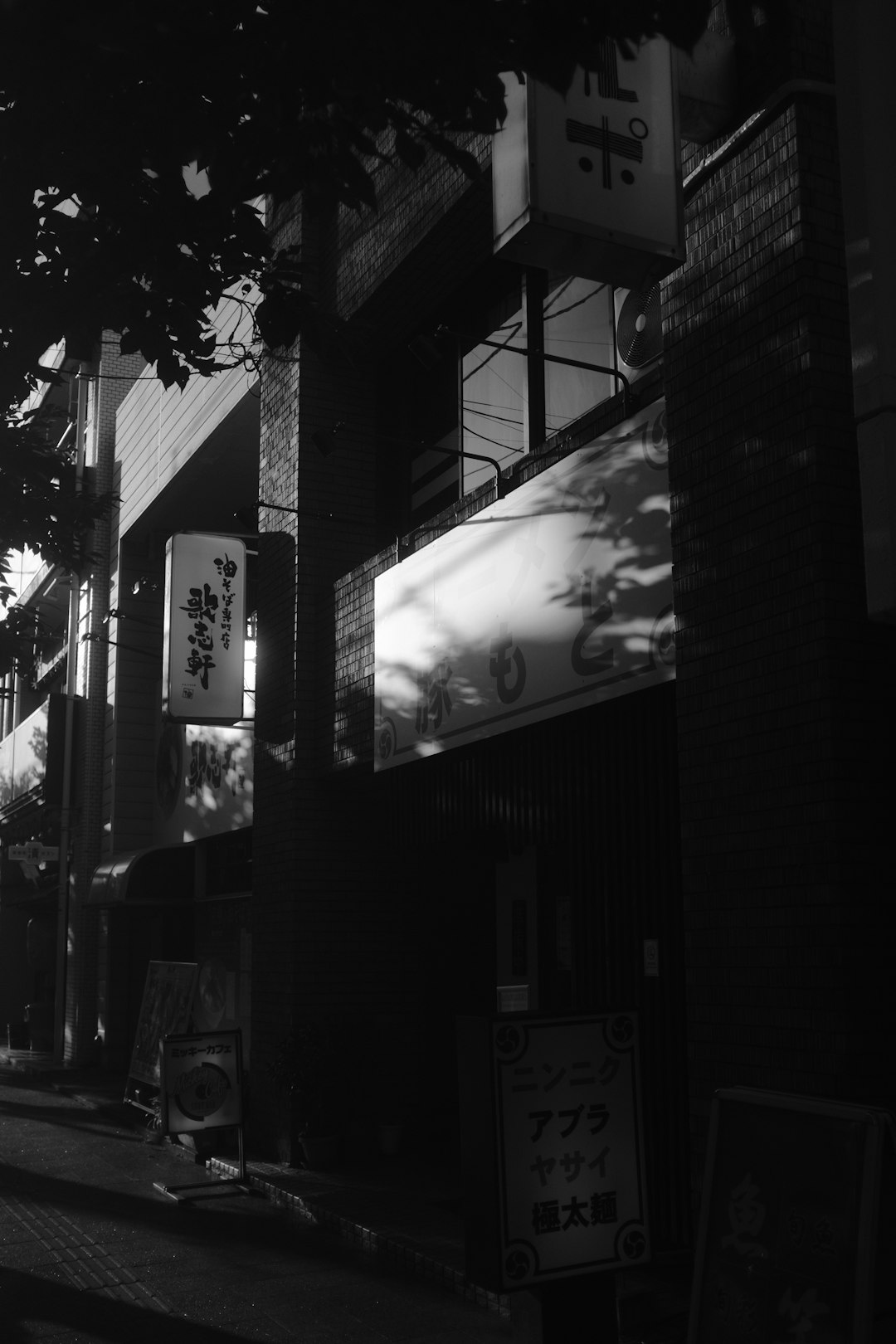 grayscale photo of store front