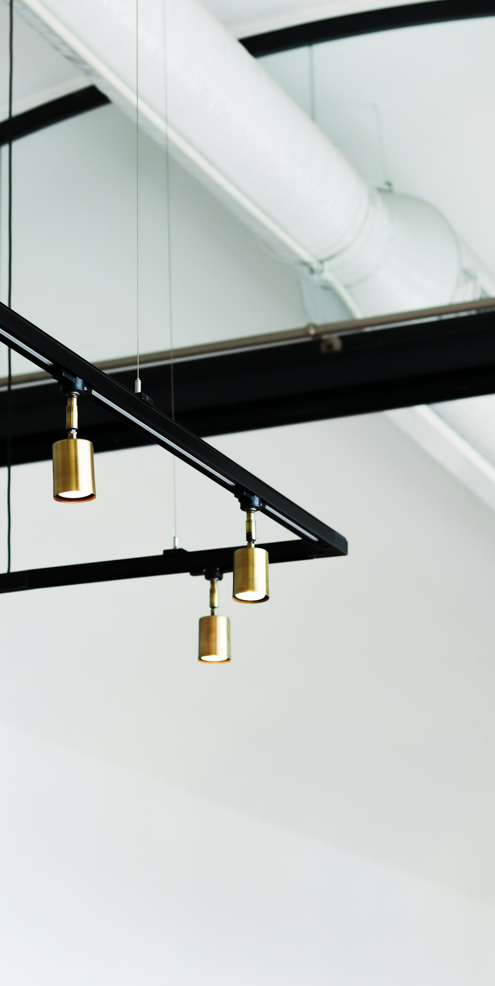 brass and white pendant lamp
