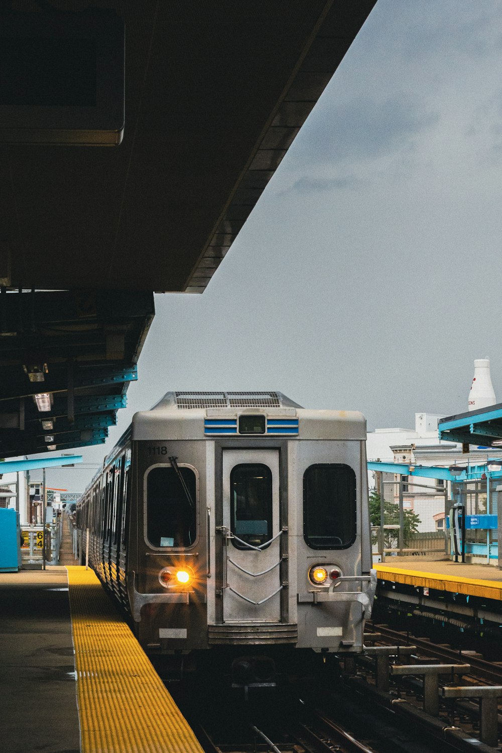 white and black train on rail during daytime