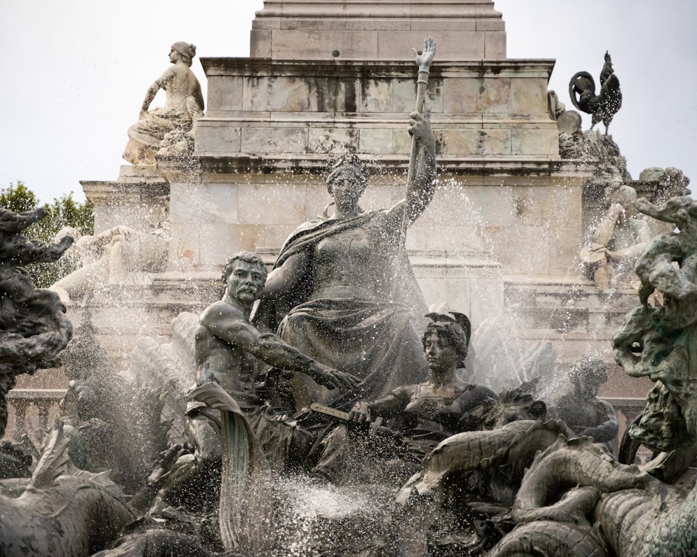 gray concrete statue fountain during daytime