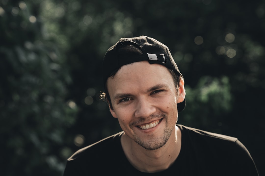 man in black leather jacket smiling