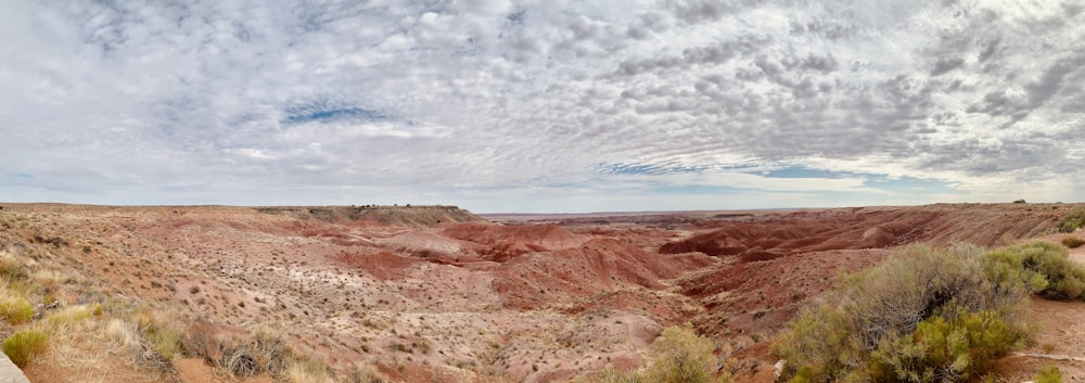 brown and gray mountains under white clouds during daytime