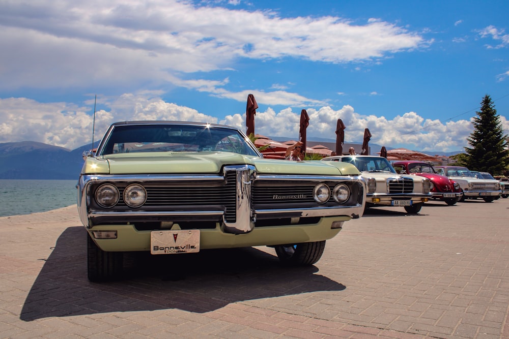 vintage blue car on road during daytime