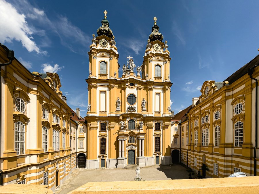 The twin towers of Melk Abbey under a blue sky