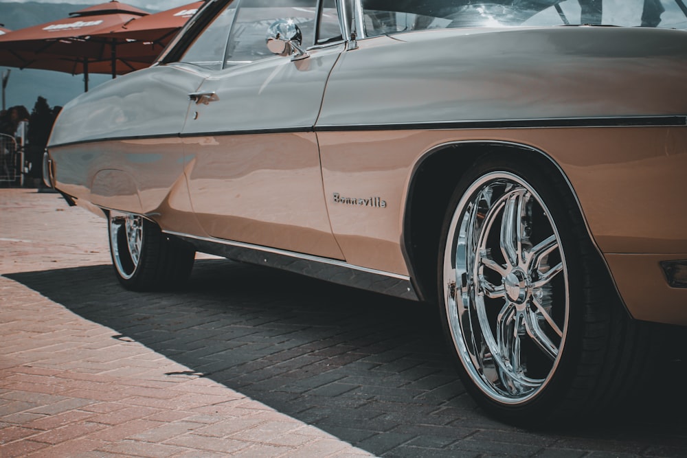 brown chevrolet camaro on road during daytime