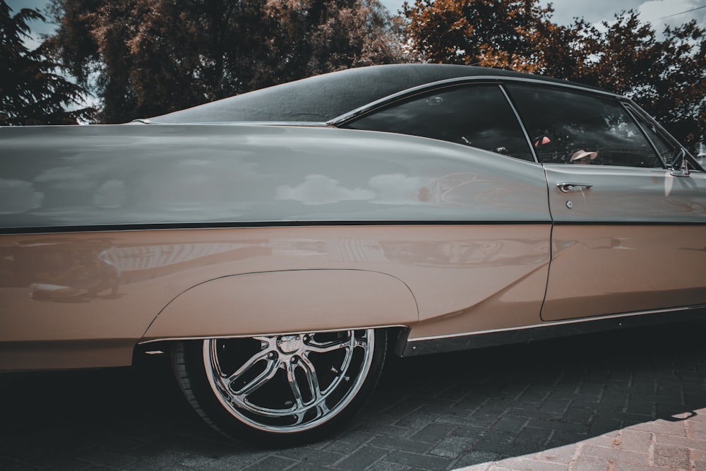 white car on gray concrete pavement