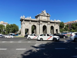 white and red coupe on road during daytime