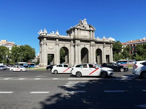 white and red coupe on road during daytime