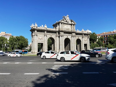 white and red coupe on road during daytime