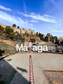 white and red welcome to the beach signage