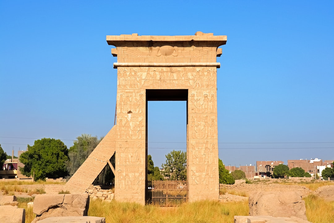 brown concrete arch under blue sky during daytime