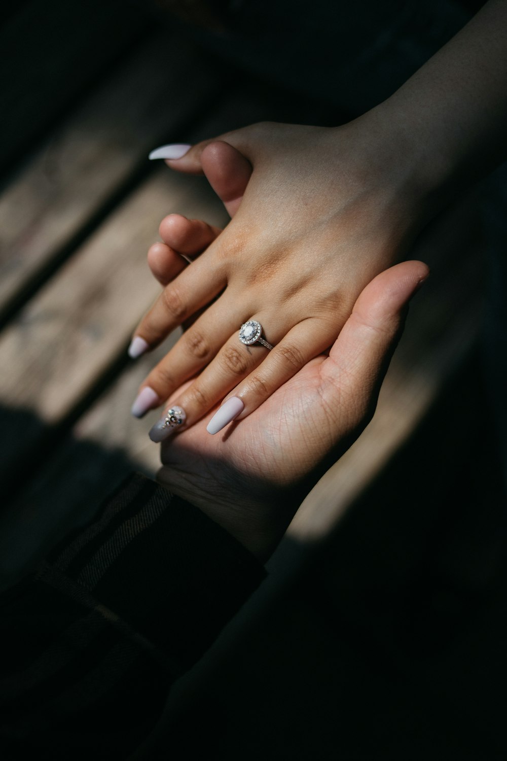 person wearing silver diamond ring