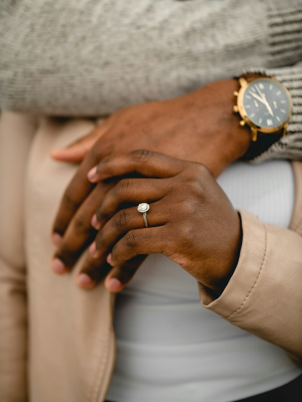 person wearing gold ring and silver ring