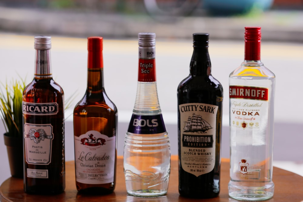 three bottles on white table