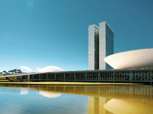 white concrete building near body of water during daytime