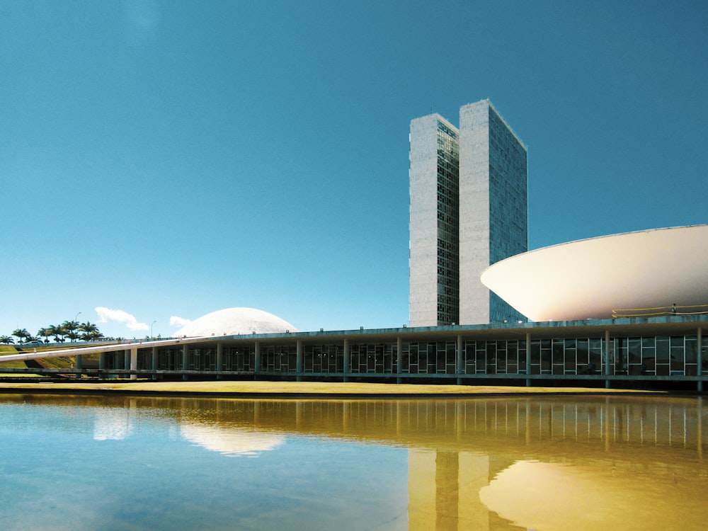 white concrete building near body of water during daytime