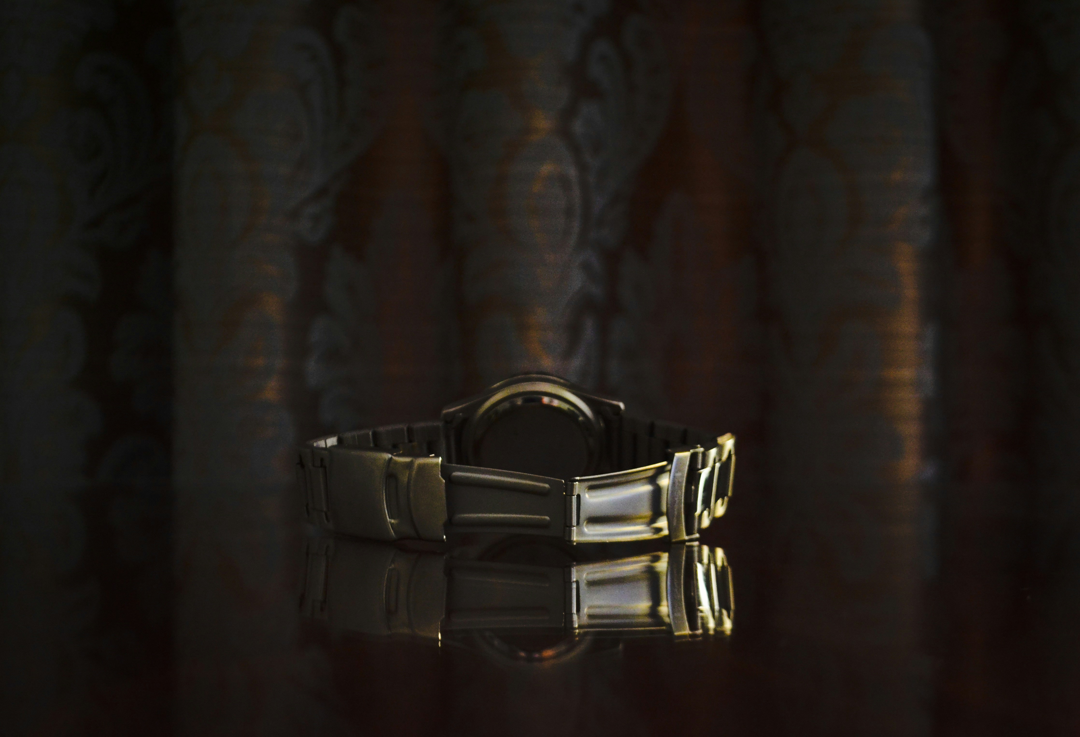 silver ring on brown textile