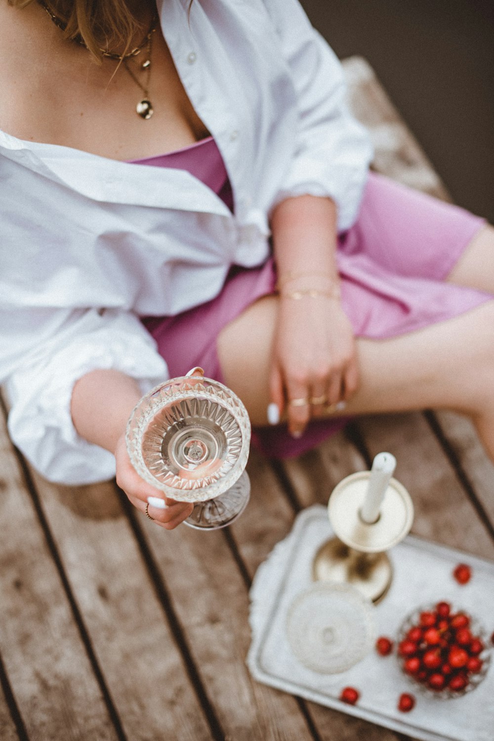 person holding white ceramic cup