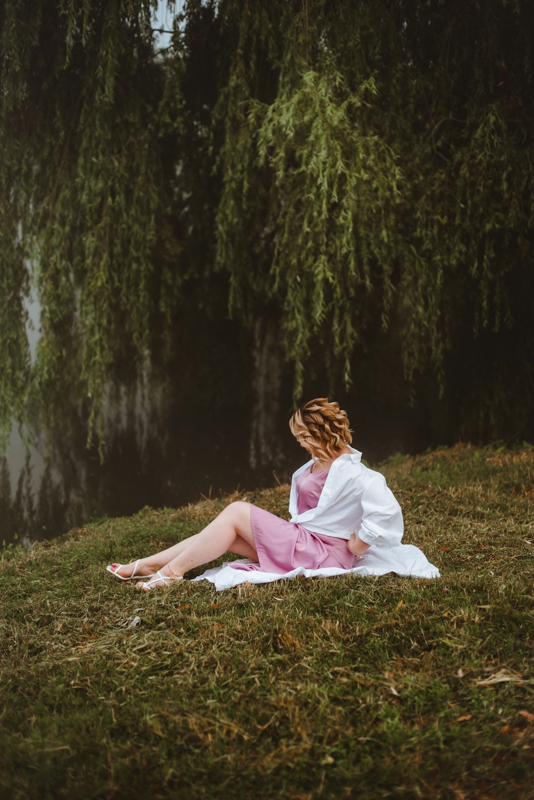 woman in white dress lying on ground