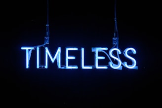 A glowing neon clock symbolizing unlimited, lifetime access to learning materials.