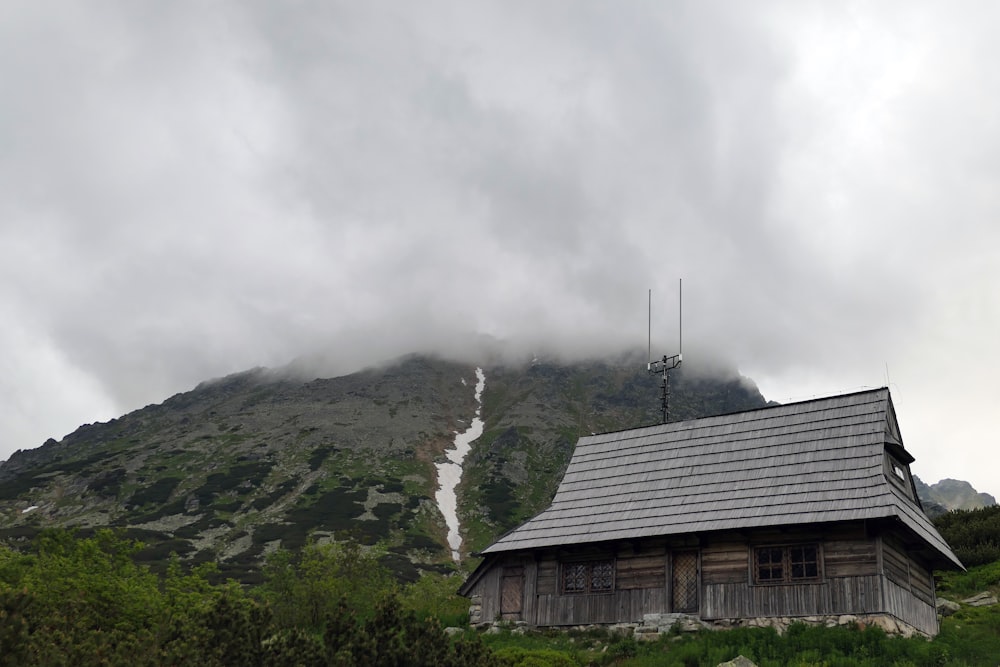 brown wooden house on top of mountain