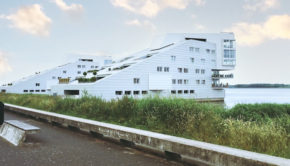 white concrete building near green grass field during daytime