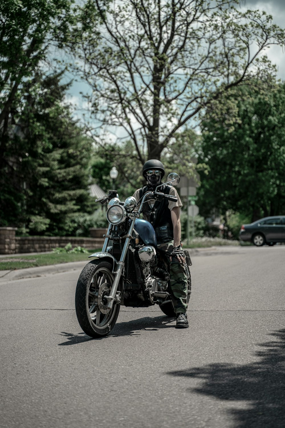 man in black motorcycle helmet riding motorcycle on road during daytime