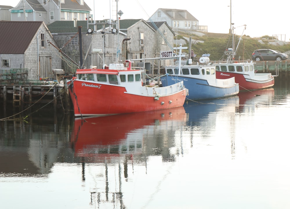 red and white boat on water during daytime