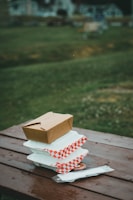 white and brown house miniature on brown wooden table