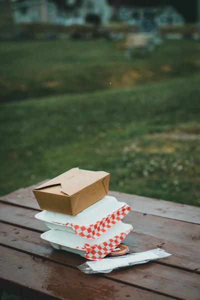 white and brown house miniature on brown wooden table