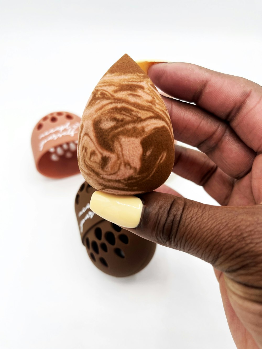 person holding brown and white heart shaped cookie