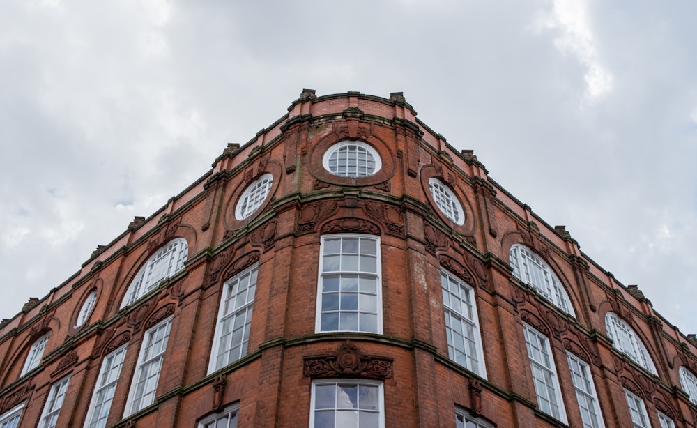 brown concrete building under white sky during daytime