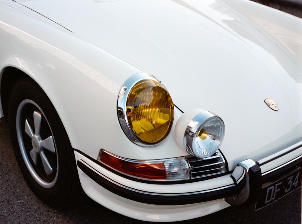 white car with chrome headlight