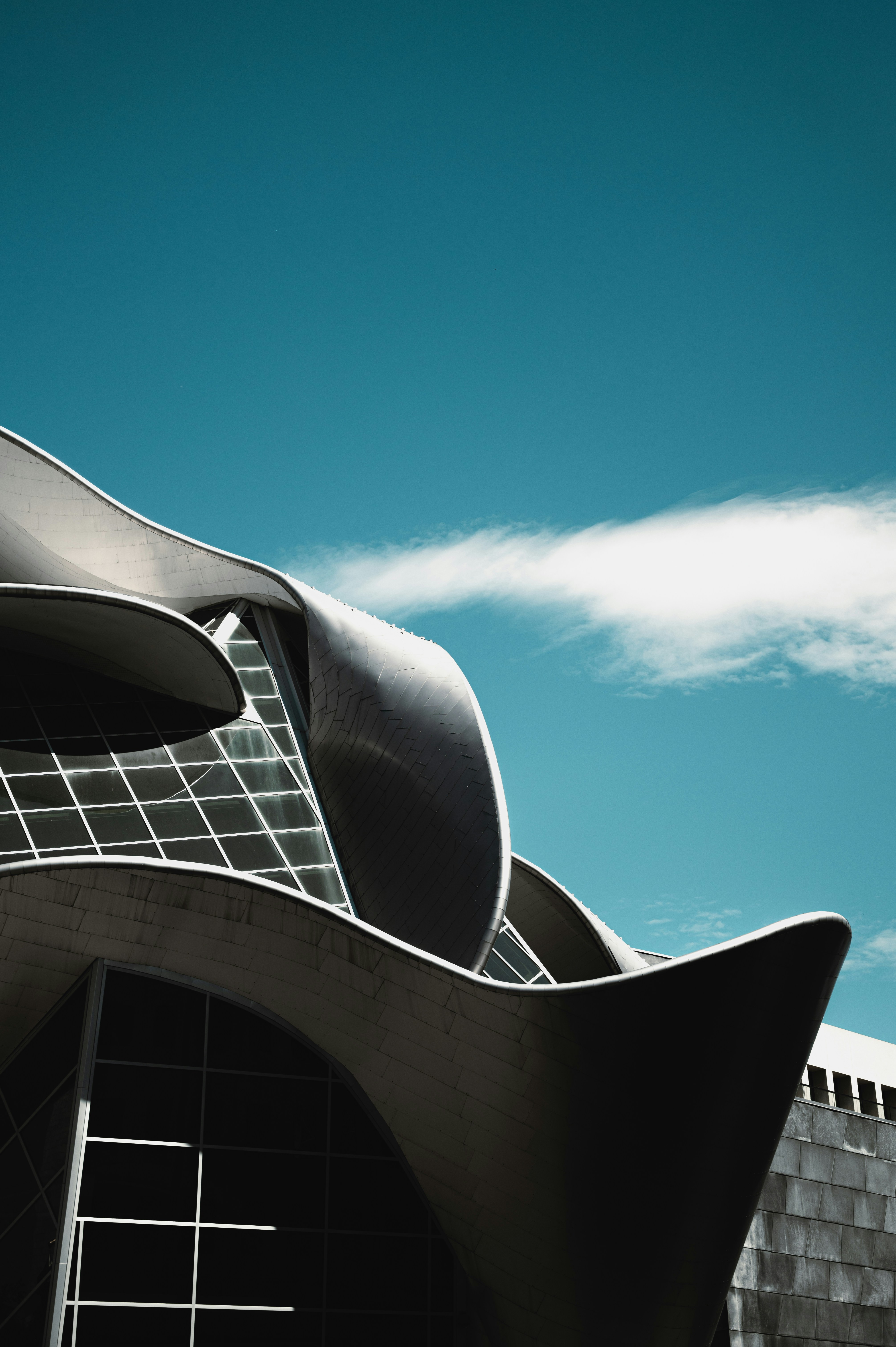 brown and white concrete building under blue sky during daytime