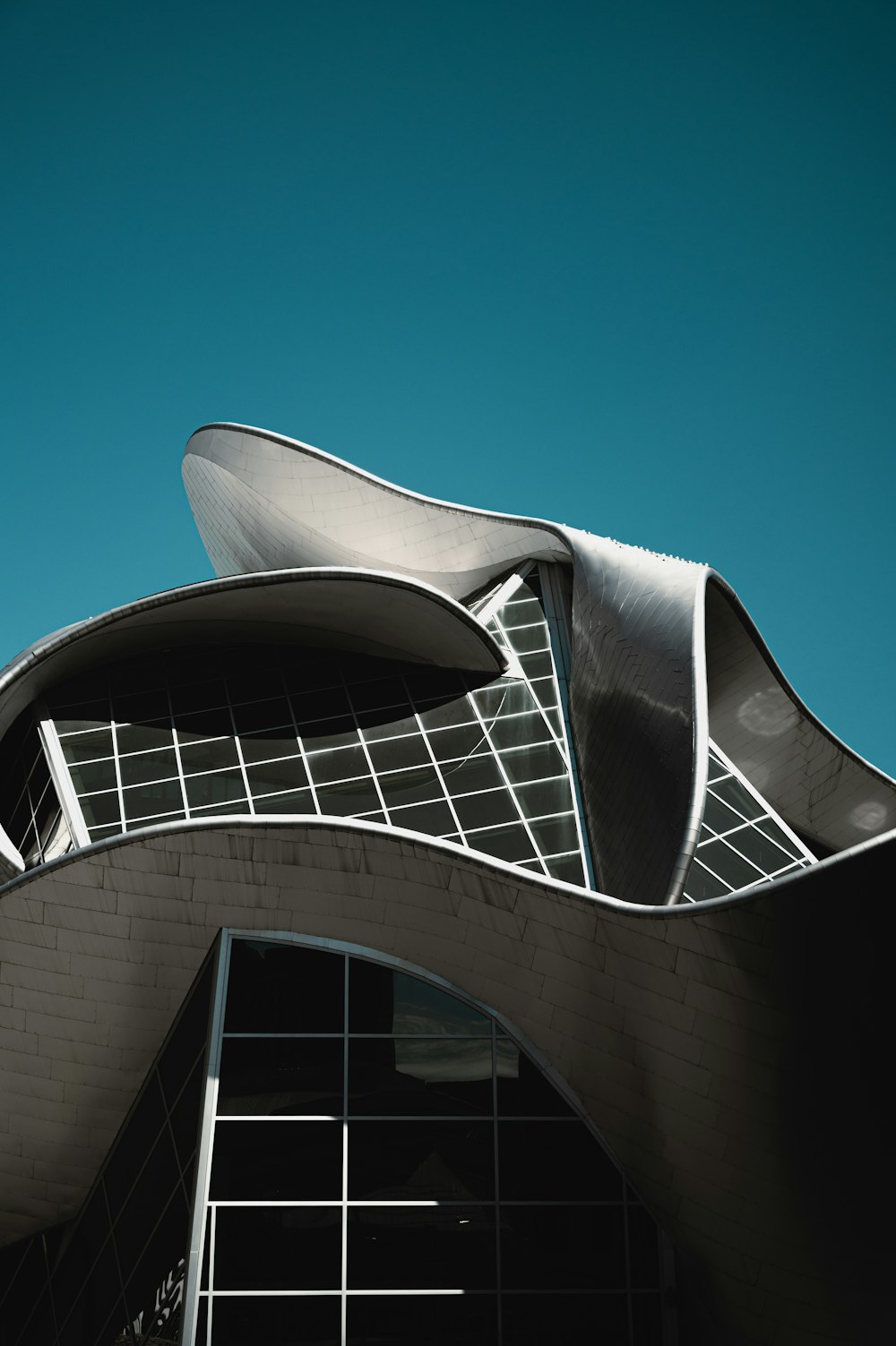 white and black concrete building under blue sky during daytime