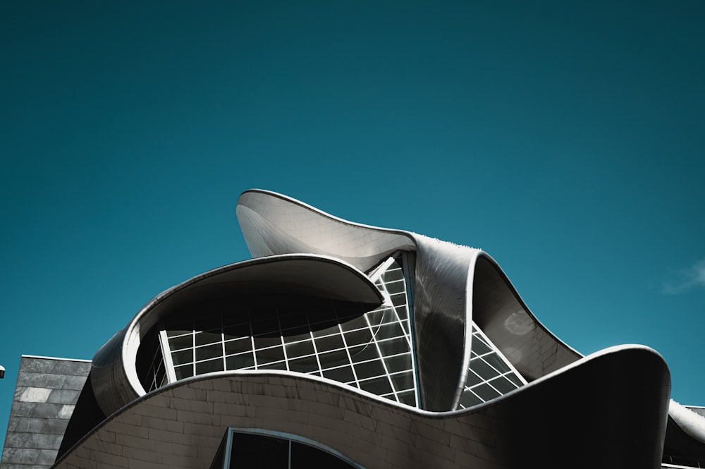 white and black concrete building under blue sky during daytime