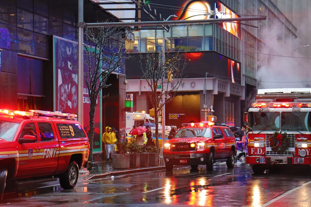 red suv on road near building during night time