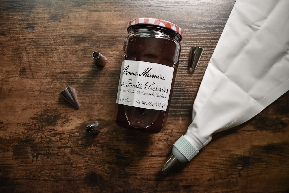 brown glass jar on brown wooden table