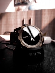 black and silver round watch