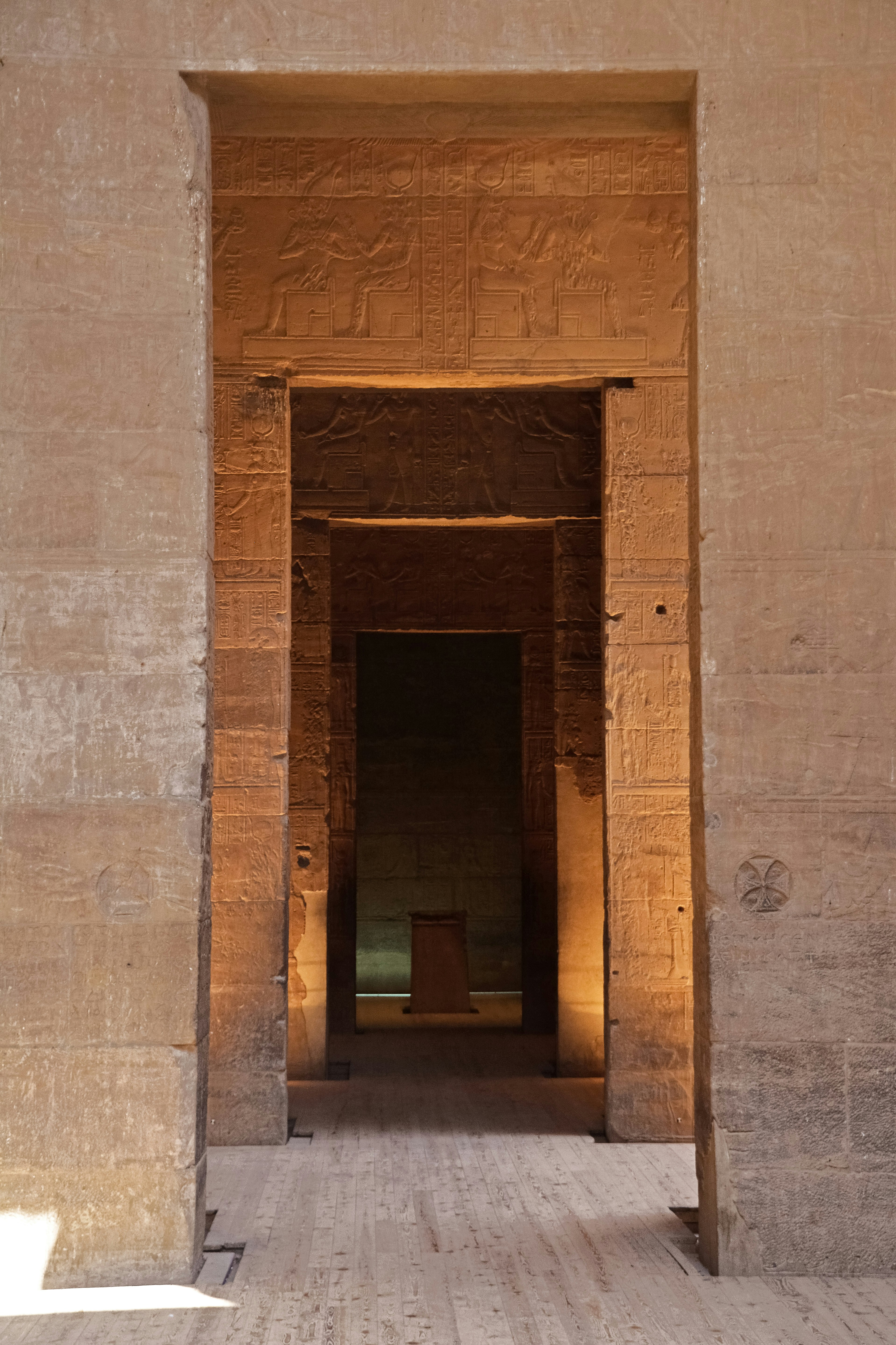 brown wooden door on gray concrete wall