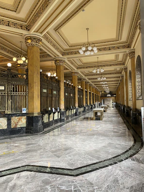 Elegant lobby interior featuring towering pillars and refined design elements.