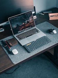 macbook pro on brown wooden table